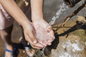 Hands in water